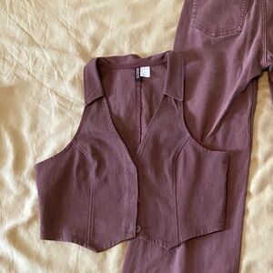 Cotton, denim like brown vest, never worn. Size Medium.